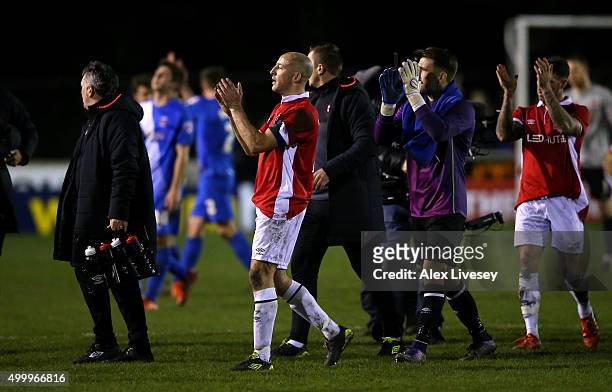 Chris Lynch of Salford City applauds the fans with his team mates following the Emirates FA Cup Second Round match between Salford City and...