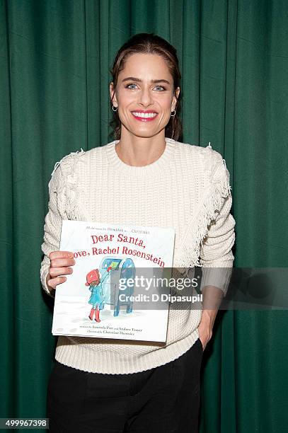 Amanda Peet promotes her book "Dear Santa, Love, Rachel Rosenstein" at Barnes & Noble 82nd Street on December 4, 2015 in New York City.