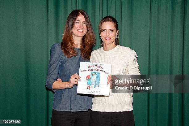 Andrea Troyer and Amanda Peet promote their book "Dear Santa, Love, Rachel Rosenstein" at Barnes & Noble 82nd Street on December 4, 2015 in New York...