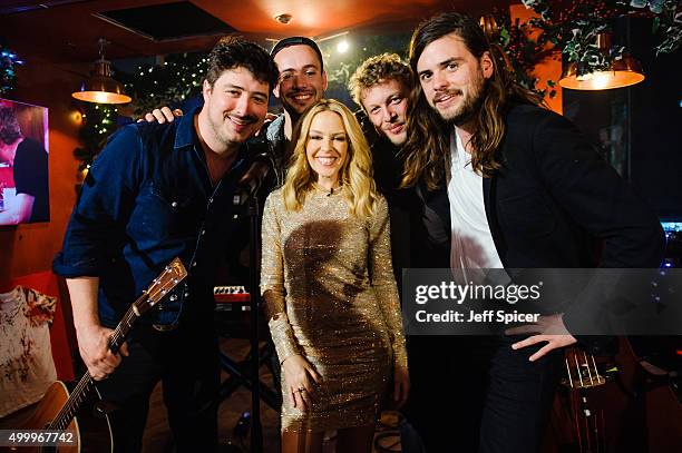 Kylie Minogue with Marcus Mumford, Ben Lovett, Ted Dwane and Winston Marshall from Mumford and Sons during a live broadcast of "TFI Friday" on...
