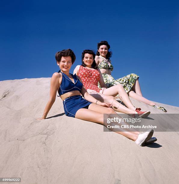 Were these three colorful and original models of playclothes worn by CBS starlets. Julia Bannon wears a water lily print silk jersey play outfit...