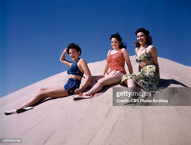 Were these three colorful and original models of playclothes worn by CBS starlets. Julia Bannon wears a water lily print silk jersey play outfit...