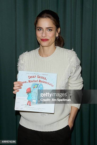Actress Amanda Peet signs copies of their book "Dear Santa, Love, Rachel Rosenstein" at Barnes & Noble 82nd Street on December 4, 2015 in New York...