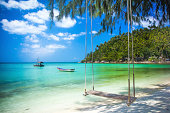 Swing hang from coconut tree over beach, Phangan island ,Thailand