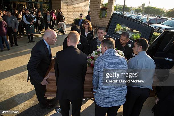 Pallbearers carry the casket of Paris attack victim Nohemi Gonzalez, from funeral services on December 4, 2015 in Downy, California. Gonzalez was one...