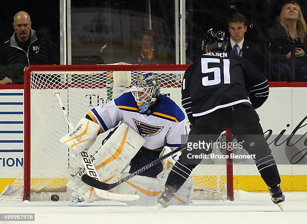 Frans Nielsen of the New York Islanders scores the game winning goal in the shootout against Brian Elliott of the St. Louis Blues on December 4, 2015...