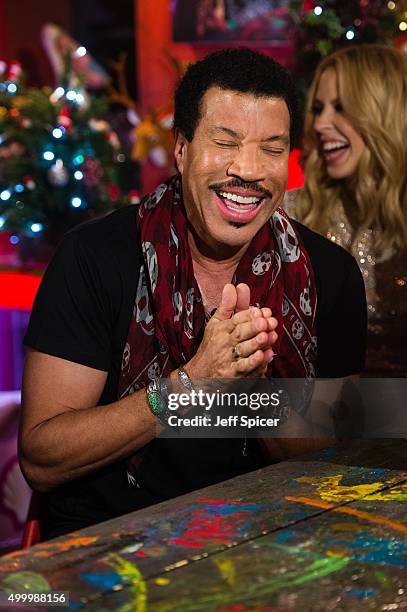 Lionel Richie and Kylie Minogue during a live broadcast of "TFI Friday" on December 4, 2015 in London, England.