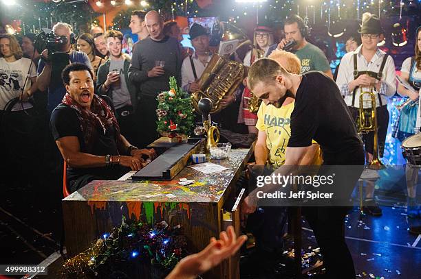 Lionel Richie and Daniel Radcliffe during a live broadcast of "TFI Friday" on December 4, 2015 in London, England.