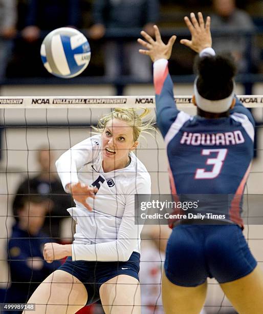 Penn State's Ali Frantti hits the ball past Howard's Dominique Cleggett during an NCAA women's volleyball tournament first-round match on Friday,...