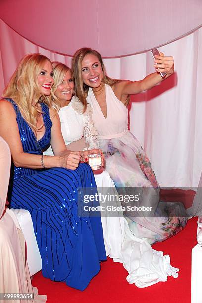 Sonya Kraus, Jennifer Knaeble and Alena Gerber making a selfie during the Mon Cheri Barbara Tag 2015 at Postpalast on December 4, 2015 in Munich,...