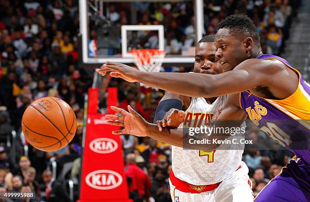 Julius Randle of the Los Angeles Lakers strips the ball from Paul Millsap of the Atlanta Hawks at Philips Arena on December 4, 2015 in Atlanta,...
