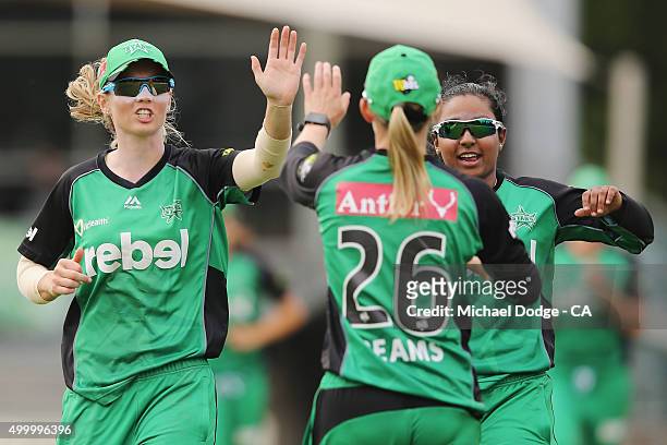 Meg Lanning of the Stars and Alana King celebrate the wicket of Lauren Winfield of the Heat during the Women's Big Bash League match between the...