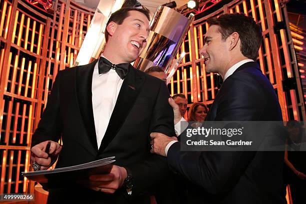 Sprint Cup Series Champion Kyle Busch gets an autograph from Jeff Gordon during the 2015 NASCAR Sprint Cup Series Awards show at Wynn Las Vegas on...