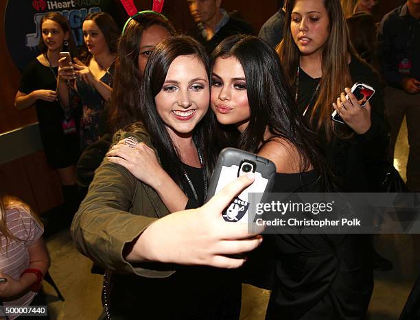 Actress/recording artist Selena Gomez poses for a selfie photo with a fan at 102.7 KIIS FMs Jingle Ball 2015 Presented by Capital One at STAPLES...