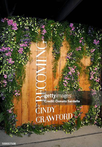 View of the backdrop during a book party in honor of "Becoming" by Cindy Crawford, hosted by Bill Guthy And Greg Renker, at Eric Buterbaugh Floral on...