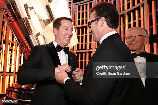 Sprint Cup Series Champion Kyle Busch talks with J.D. Gibbs during the 2015 NASCAR Sprint Cup Series Awards show at Wynn Las Vegas on December 4,...