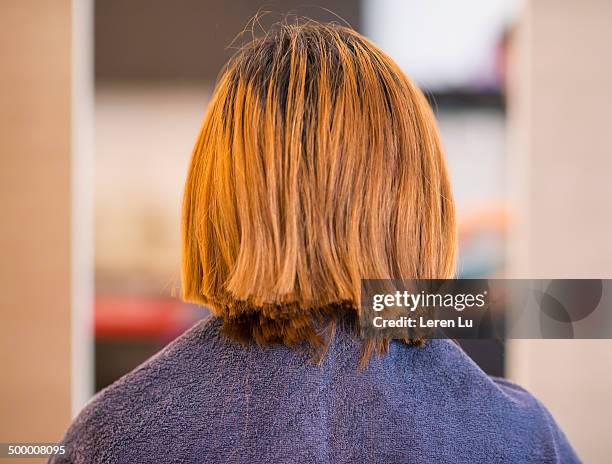 young woman cutting hair - uneven stock pictures, royalty-free photos & images