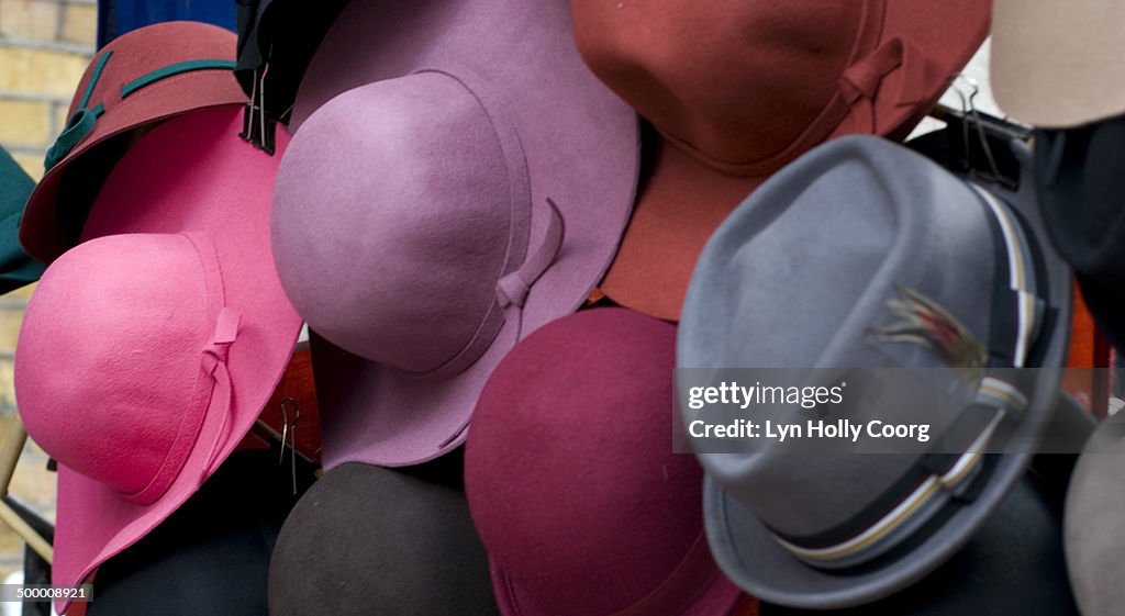 Colourful men and women felt hats on display