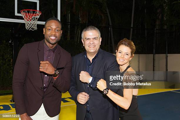 Dwyane Wade flexes his timepiece with Hublot CEO Ricardo Guadalupe and Bloomberg's Stephanie Ruhle before Hublot & Haute Living Toast Art Basel with...