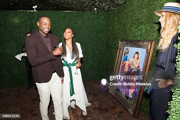 Dwyane Wade and Gabrielle Union share a laugh during Hublot & Haute Living Toast Art Basel Private Dinner hosted by Dwyane Wade & Gabrielle Union on...