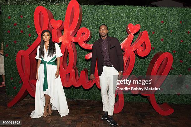 Gabrielle union and Dwyane Wade strike a pose at the Hublot & Haute Living Toast Art Basel with Private Dinner hosted by Dwyane Wade & Gabrielle...