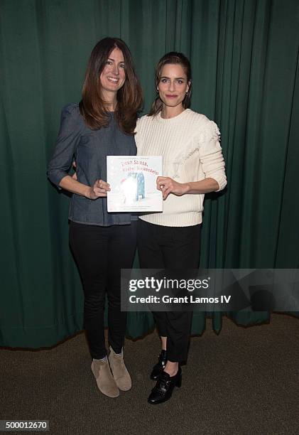 Andrea Troyer and Amanda Peet promote their book 'Dear Santa, Love, Rachel Rosenstein' at Barnes & Noble 82nd Street on December 4, 2015 in New York...