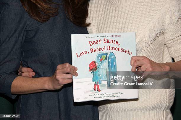 Andrea Troyer and Amanda Peet promote their book 'Dear Santa, Love, Rachel Rosenstein' at Barnes & Noble 82nd Street on December 4, 2015 in New York...