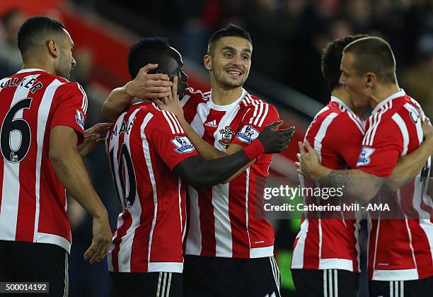 Dusan Tadic of Southampton celebrates with Sadio Mane of Southampton during the Capital One Cup Quarter Final between Southampton and Liverpool at St...