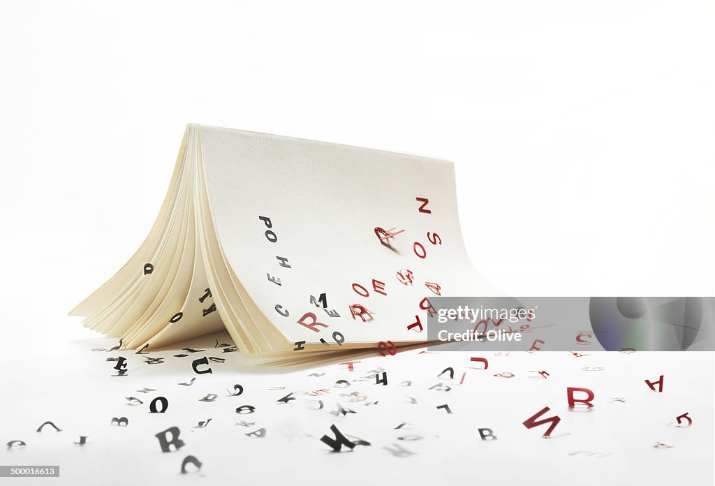 Letters running away from a book