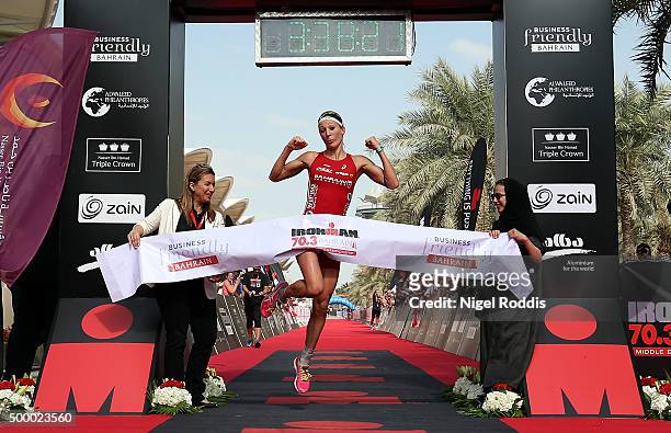 Daniela Ryf of Switzerland celebrates winning the Triple Crown and 0ne million dollars after winning Ironman Bahrain on December 5, 2015 in Bahrain,...