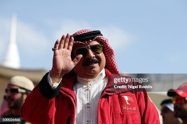 King of Bahrain Hamad bin Isa Al Khalifa waves to the crowd on the finishing line of Ironman Bahrain on December 5, 2015 in Bahrain, Bahrain.