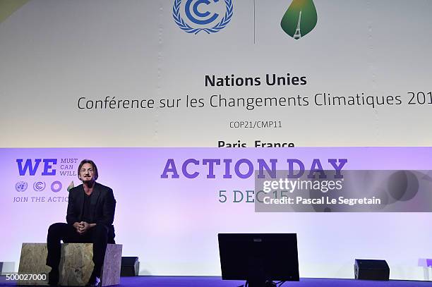 Actor Sean Penn makes a speech for the Action Day during the 21st Session Of Conference On Climate Change on December 5, 2015 in Paris, France. He is...