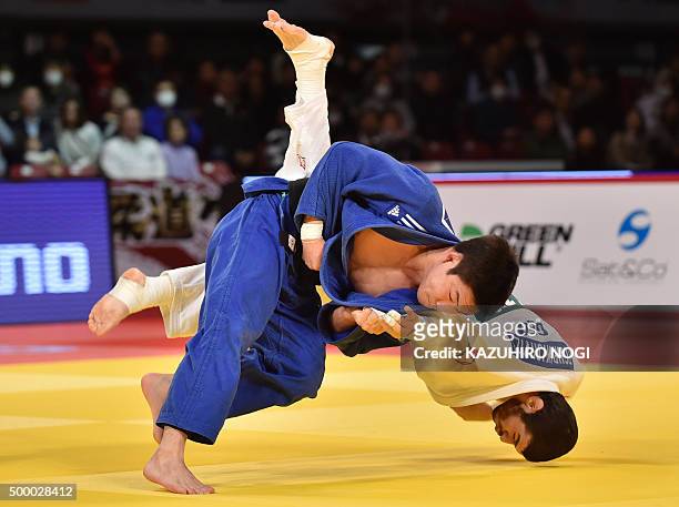South Korea's Lee Seungsu throws Georgia's Avtandili Tchrikishvili in the men's 81-kilogram category final match at the Judo Grand Slam Tokyo on...