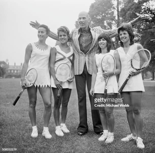 English fashion designer Ted Tinling , with tennis players wearing his Dacron fashions at the Royal Garden Hotel, Kensington, London, 22nd June 1973....