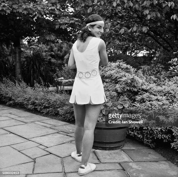 American tennis player Julie Heldman modeling a Dacron and polyester cotton dress by English fashion designer Ted Tinling at a press preview of the...