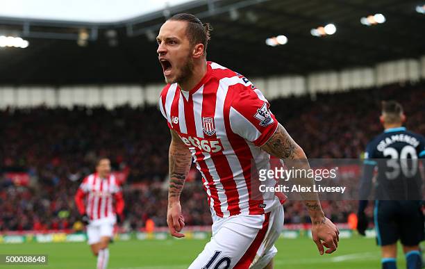 Marko Arnautovic of Stoke City celebrates scoring his team's first goal during the Barclays Premier League match between Stoke City and Manchester...