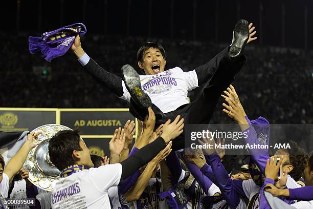 Hajime Moriyasu the head coach / manager of Sanfrecce Hiroshima is thrown into the air as Sanfrecce Hiroshima celebrate winning the J.League 2015...