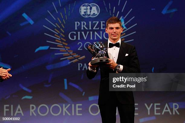 Max Verstappen of Netherlands and Scuderia Toro Rosso receives his trophy for Rookie of the Year during the 2015 FIA Prize-Giving Ceremony at the...