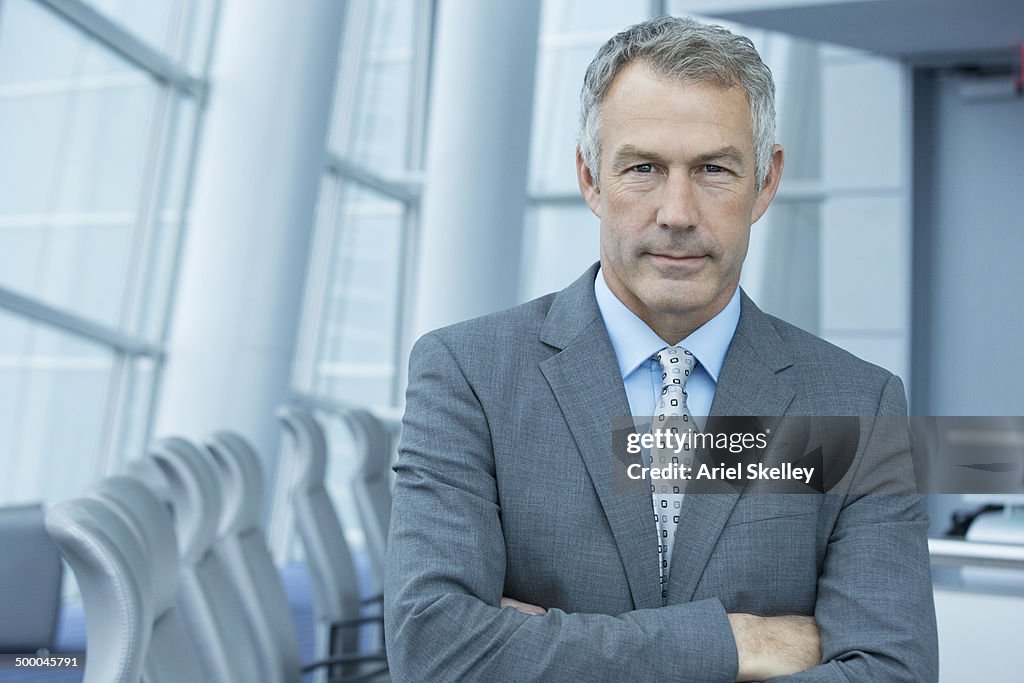 Caucasian businessman standing in conference room