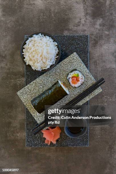 plate of sushi with rice and pickled ginger - hand roll stock pictures, royalty-free photos & images