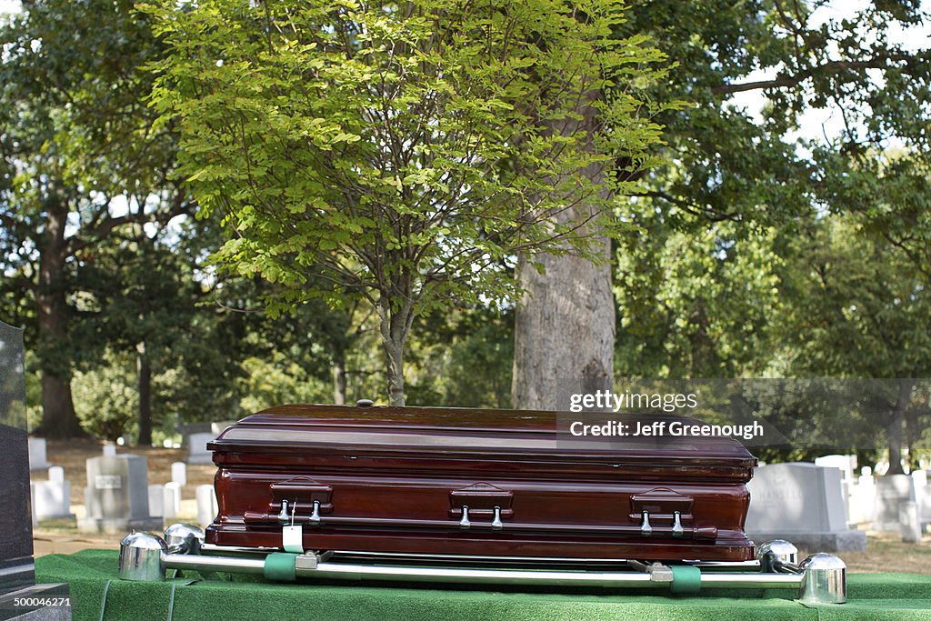 Coffin lowering into grave in military cemetery, Arlington, Virginia, United States