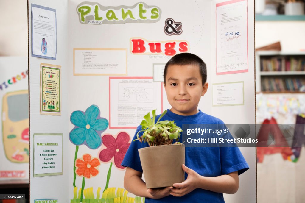 Student giving presentation on plants and bugs