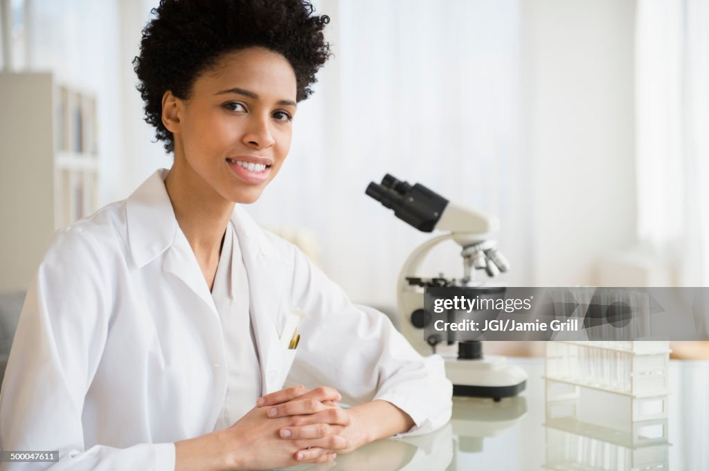 Black scientist smiling in lab