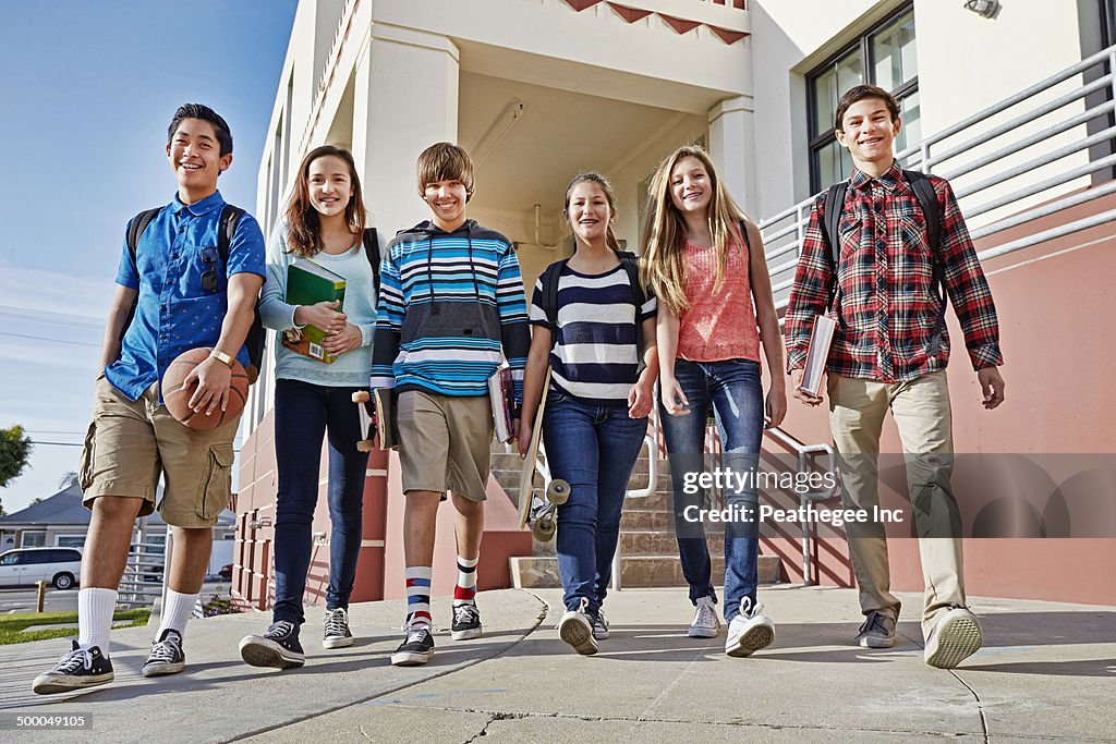 Teenagers walking out of school