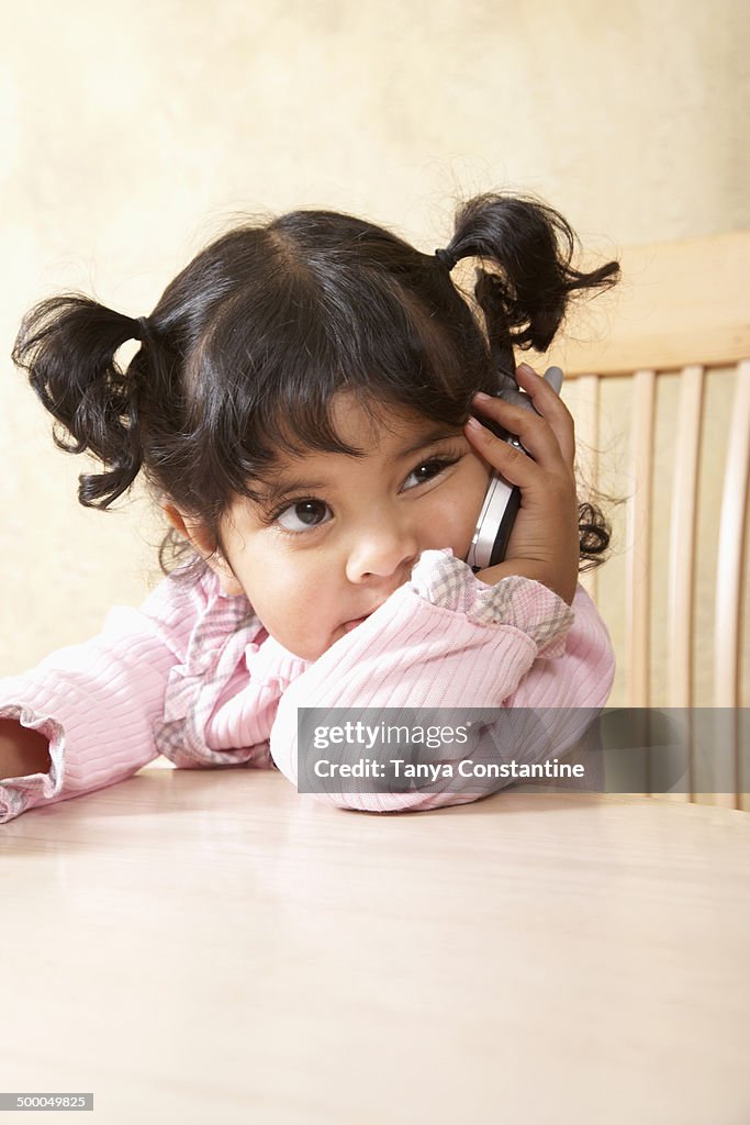 Hispanic girl talking on cell phone