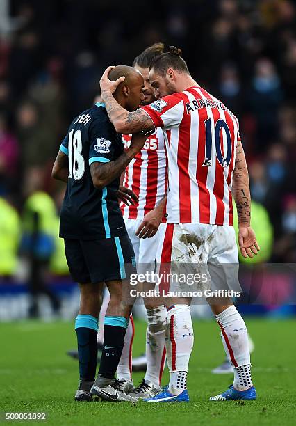 Marko Arnautovic of Stoke City and Fabian Delph of Manchester City argue after the Barclays Premier League match between Stoke City and Manchester...