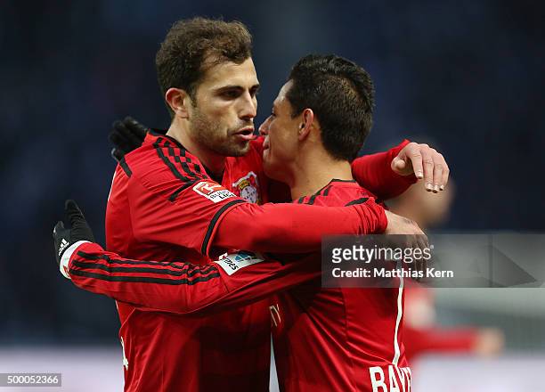 Chicharito of Leverkusen jubilates with team mate Admir Mehmedi after scoring the second goal during the Bundesliga match between Hertha BSC and...