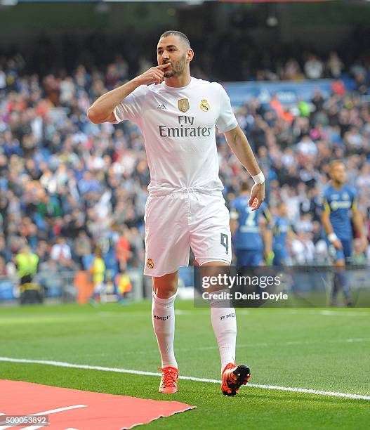 Karim Benzema of Real Madrid celebrates after scoring his team's opening goal during the La Liga match between Real Madrid CF and Getafe CF at...