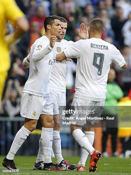 Cristiano Ronaldo of Real Madrid celebrates with Gareth Bale and Karim Benzema after scoring their team's fourth goal during the La Liga match...