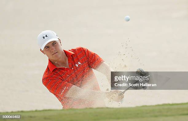 Jordan Spieth of the United States plays a bunker shot on the third hole during the third round of the Hero World Challenge at Albany, The Bahamas on...